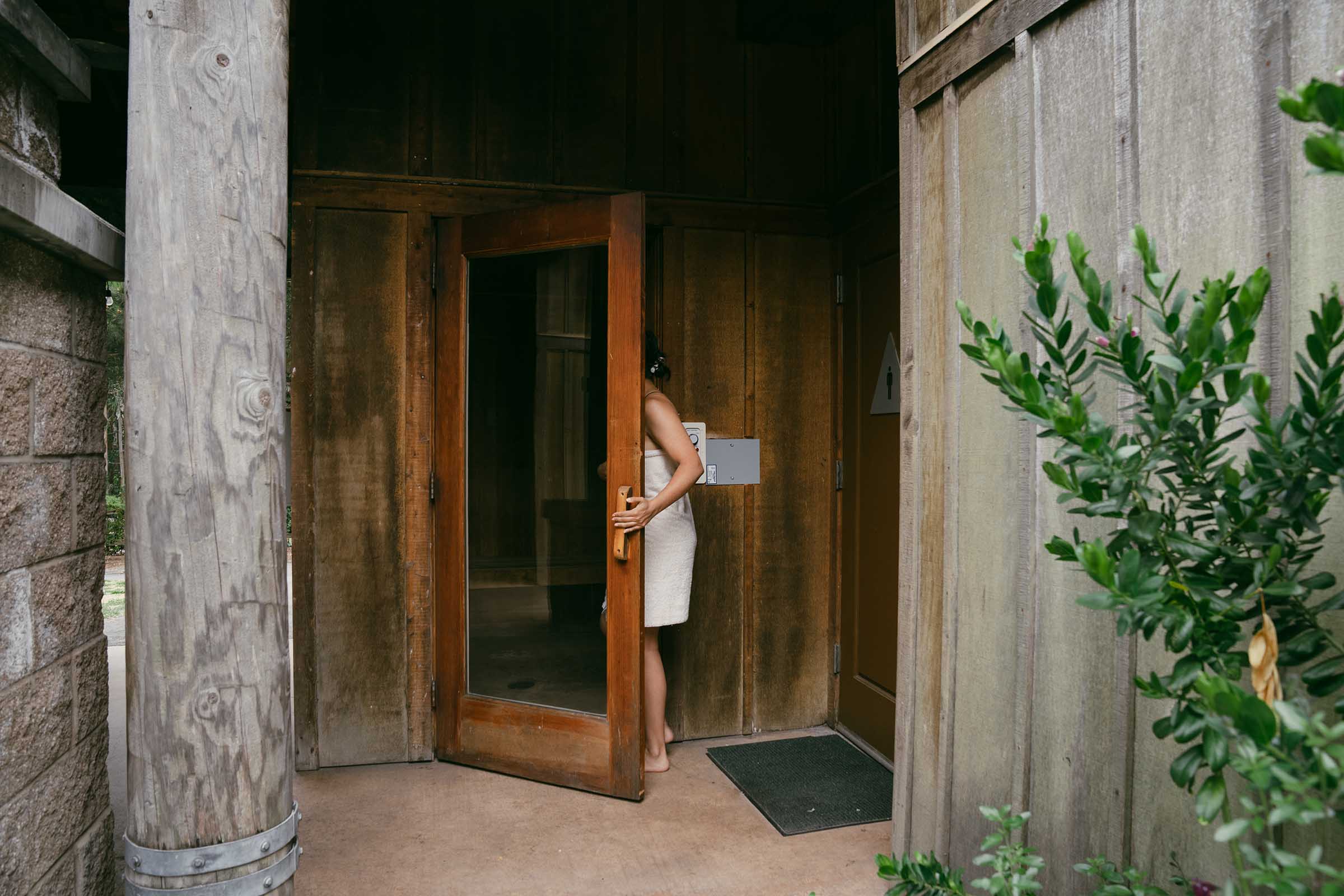 Woman going into a sauna